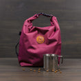 Load image into Gallery viewer, Huckleberry purple dog food storage travel bag with roll-top closure and orange logo
