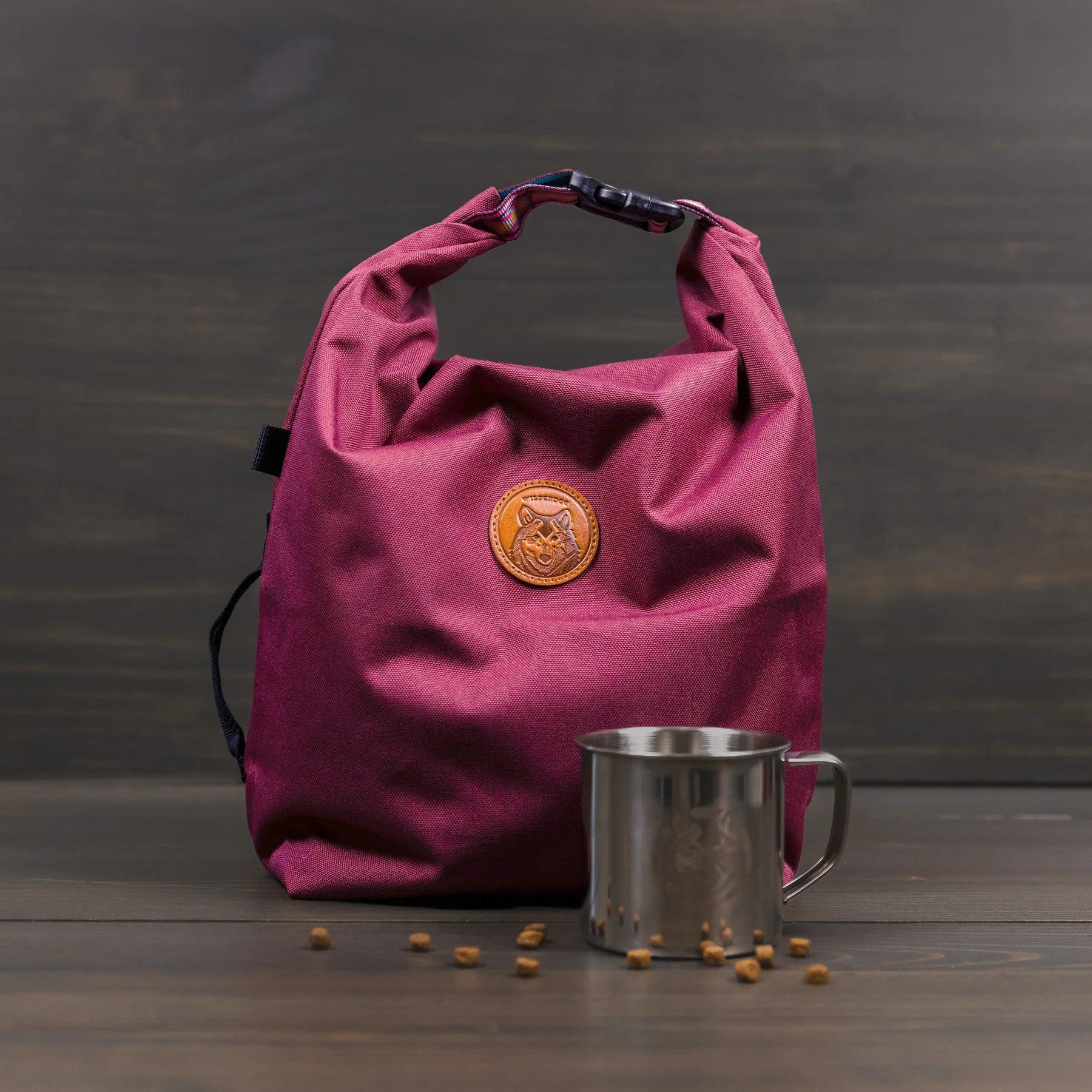 Huckleberry purple dog food storage travel bag with roll-top closure and orange logo